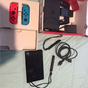 Nintendo Switch Console with Red and Blue Controllers